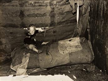 MARION POST WOLCOTT (1910-1990) Three photographs depicting the children of migrant packing house workers who are living in a lean to